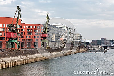 German inner harbour with port cranes in Duisburg Stock Photo