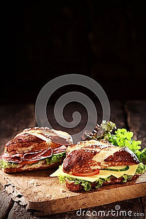 German lye rolls with cheese and salami Stock Photo