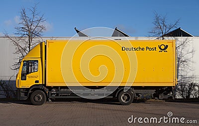 German mail service Deutsche Post logo on a yellow container Editorial Stock Photo