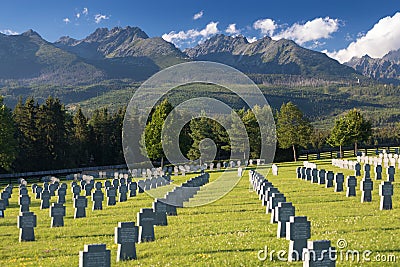 German military cemetery in autumn with mountains in the background and many graves of soldiers killed in the Second World War. Editorial Stock Photo