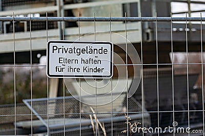 German notice Sign Parents are liable for their children in front of a - Privatgelaende - private property Stock Photo