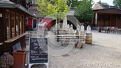 German outdoor terrace restaurant in the yard of castle Satzvey Editorial Stock Photo