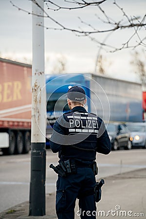 German Polizei Police officer inspecting the border crossing Editorial Stock Photo