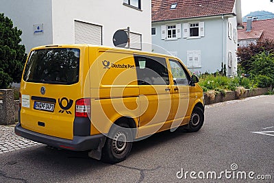 German Post bus in Offenburg, Germany Editorial Stock Photo