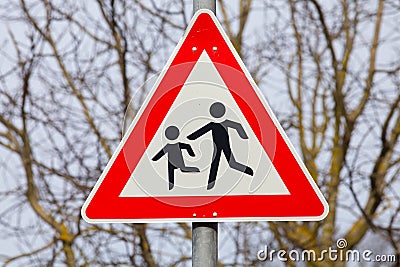 German sign attention children crossing street warning car drivers Stock Photo