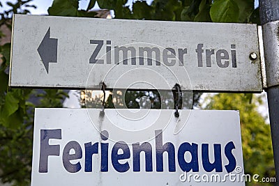 German sign Zimmer frei and Ferienhaus Stock Photo