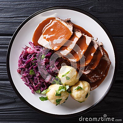 German Slow Cooker Pot Roast Sauerbraten with potato dumplings Stock Photo