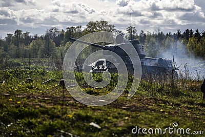 German soldiers and russian tank. Historical reconstruction, soldiers fighting during World War II. Editorial Stock Photo