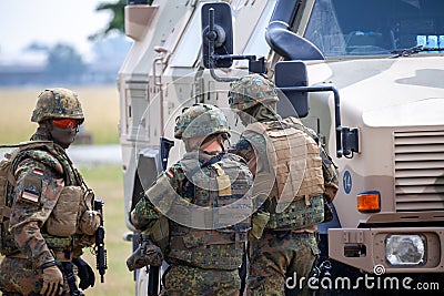 German soldiers stands near military vehicles Editorial Stock Photo