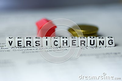 German Word INSURANCE formed by alphabet blocks: VERSICHERUNG Stock Photo