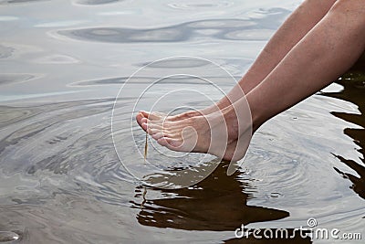 Germany, Baltic Sea, woman, feet in the water Stock Photo