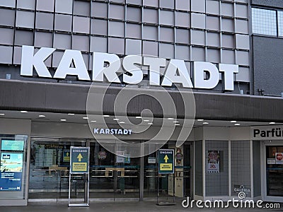 Traditional Karstadt department store. Modern environment in a lot of built-in concrete, the company`s lettering dominates Editorial Stock Photo