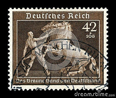 GERMANY - CIRCA 1939: German historical stamp: A tamer tames two horses. 6th annual German horse racing championship `Brown ribbon Editorial Stock Photo