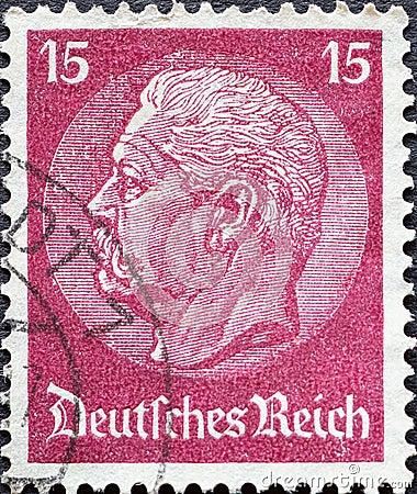 GERMANY - CIRCA 1933: a postage stamp from Germany, showing a portrait of the Reich President Paul von Hindenburg on a medallion Editorial Stock Photo