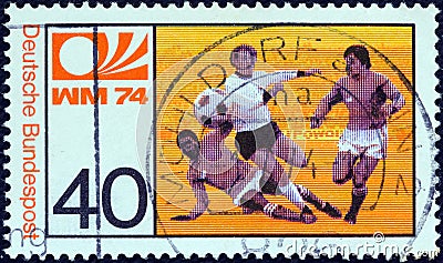 GERMANY - CIRCA 1974: A stamp printed in Germany from the `World Cup Football Championship` issue shows midfield melee Editorial Stock Photo