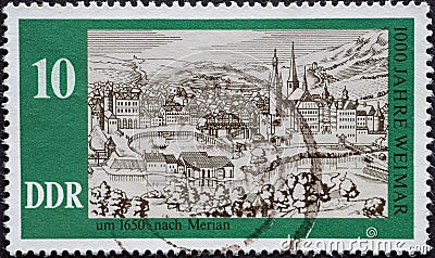 GERMANY, DDR - CIRCA 1975 : a postage stamp from Germany, GDR showing a city view of Weimar around 1650: copper engraving by Matth Editorial Stock Photo