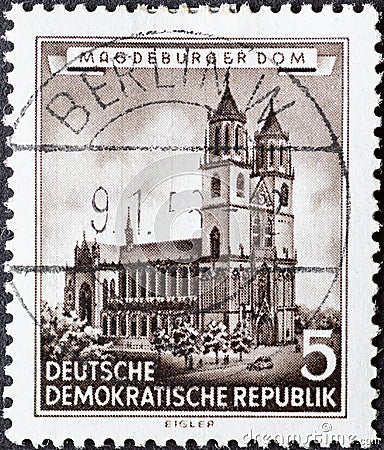 GERMANY, DDR - CIRCA 1955 : a postage stamp from Germany, GDR showing a drawing of the Magdeburg Cathedral. Restored historical b Editorial Stock Photo