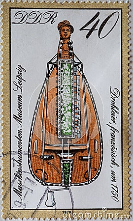 GERMANY, DDR - CIRCA 1979 : a postage stamp from Germany, GDR showing a hurdy-gurdy France around 1750 from the Musikinstrumente Editorial Stock Photo
