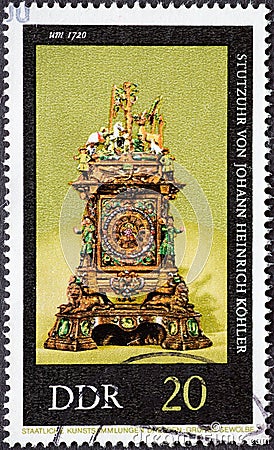 GERMANY, DDR - CIRCA 1975: a postage stamp from Germany, GDR showing an old Stutzuhr Hubertusuhr by Johann Heinrich KÃ¶hler and J Editorial Stock Photo