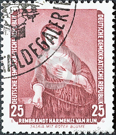 GERMANY, DDR - CIRCA 1957 : a postage stamp from Germany, GDR showing the painting `Saskia with the red flower` by Rembrandt. Pa Editorial Stock Photo