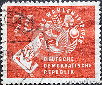 GERMANY, DDR - CIRCA 1950: a postage stamp from Germany, GDR showing Symbols from the world of work with dove of peace and ballot Editorial Stock Photo