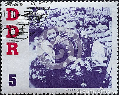 GERMANY, DDR - CIRCA 1961 : a postage stamp from Germany, GDR showing Titov and Young Pioneers. Visit of the Soviet cosmonaut Germ Editorial Stock Photo