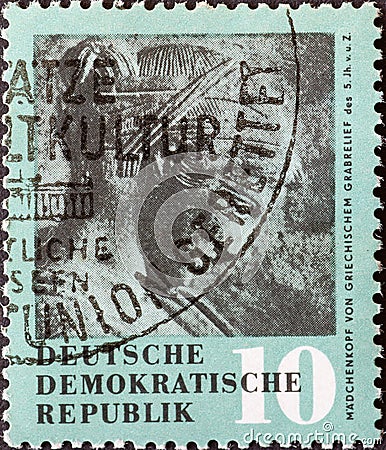 GERMANY, DDR - CIRCA 1958 : a postage stamp from Germany, GDR showing an ancient girl`s head from a Greek grave relief Editorial Stock Photo