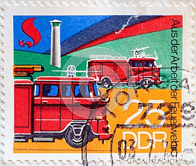 GERMANY, DDR - CIRCA 1977 : a postage stamp from Germany, GDR showing Fire watchtower, fire engine, tank fire engine. fire Departm Editorial Stock Photo