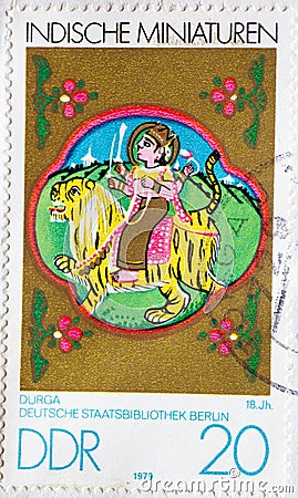 GERMANY, DDR - CIRCA 1979 : a postage stamp from Germany, GDR showing an Indian miniatures: Durga 18th century Editorial Stock Photo