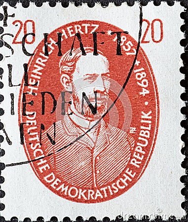 GERMANY, DDR - CIRCA 1957 : a postage stamp from Germany, GDR showing a portrait of physicist Heinrich Hertz in a red oval. Famous Editorial Stock Photo