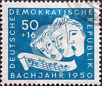 GERMANY, DDR - CIRCA 1950: a postage stamp from Germany, GDR showing Three singing masks, excerpt with the sequence B-A-C-H. Bach Editorial Stock Photo