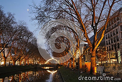 The moat that divides the main shopping street is festively illuminated for Christmas Editorial Stock Photo
