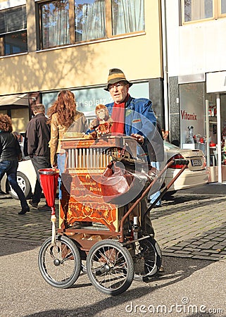 Germany, Dusseldorf: Organ Grinder With Antique Barrel Organ Editorial Stock Photo