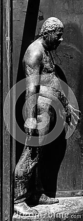 Germany, Luebeck, June 19, 2017, Bronze statue with the name, revolving door, in the pedestrian zone in Luebeck Editorial Stock Photo