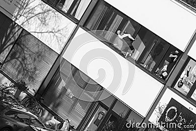 Germany, Regensburg, February 14, 2017, Street photography of some Window cleaner unsafe on the job Editorial Stock Photo