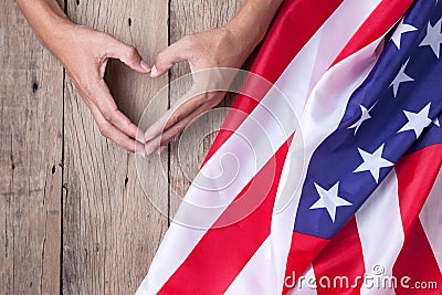 Gesture made by hands showing symbol of heart with american flag Stock Photo
