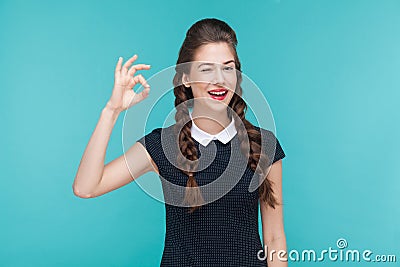 Gesture woman toothy smile and showing ok sign at camera. Stock Photo