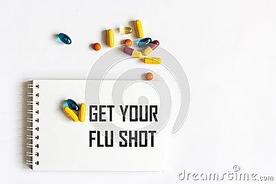 Get a flu shot, write on a notepad, on a white background Stock Photo