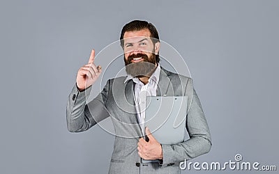Get inspired. Ready for sale. Pleasant cheerful handsome realtor holding folder. bearded man work in office. Portrait of Stock Photo