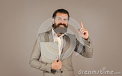 get inspired. Ready for sale. Pleasant cheerful handsome realtor holding folder. bearded man work in office. Portrait of Stock Photo