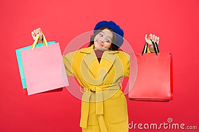 Get major wardrobe refresh with spring sales at stores. Obsessed with shopping. Girl cute kid hold shopping bags red Stock Photo