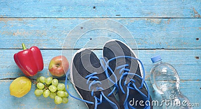 Getting fit and reducing weight for the springtime, pair of runners and fruit,free copy space,flat lay Stock Photo