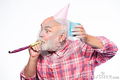 Getting older is still fun. Elderly people. Man bearded grandpa with birthday cap and drink cup. Birthday crazy party Stock Photo