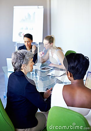 Getting together to brainstorm. a group of coworkers having a meeting in the boardroom. Stock Photo