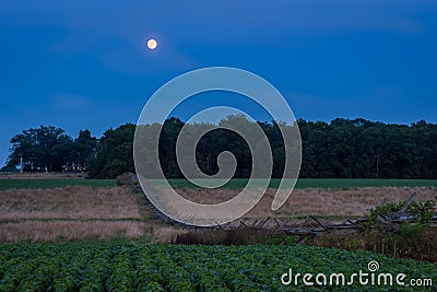 Gettysburg, PA / USA - July 26, 2018: Wooden fence with moon in the background in blue hour Editorial Stock Photo