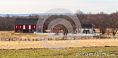 Gettysburg, Pennsylvania, USA March 13, 2021 A farm house and red barn on the battlefield at Gettysburg National Military Park Editorial Stock Photo