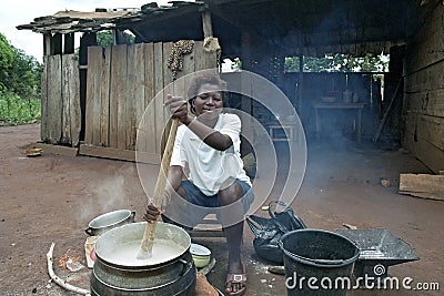 Portrait of Ghanaian Woman who is cooking outside Editorial Stock Photo