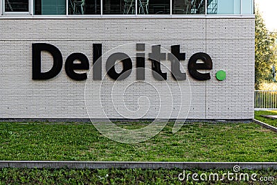 Ghent, East Flanders Region, Belgium - Logo of the Deloitte auditing and accountant consulting company Editorial Stock Photo