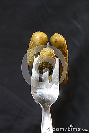 Gherkins on a fork Stock Photo