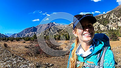 Ghermu - A girl having fun while hiking in Himalayas Stock Photo